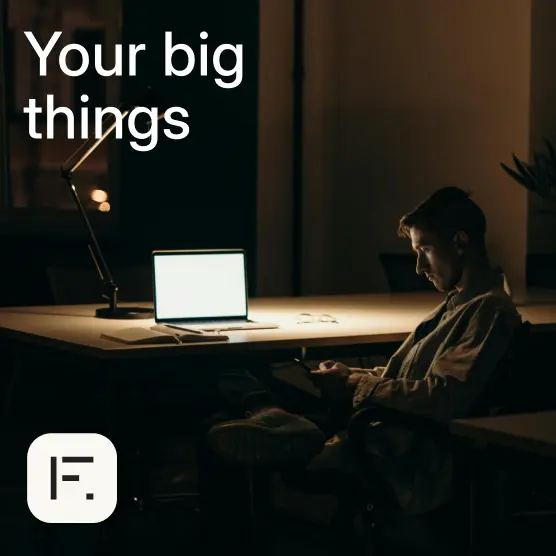 Focused entrepreneur at a dimly lit desk late at night